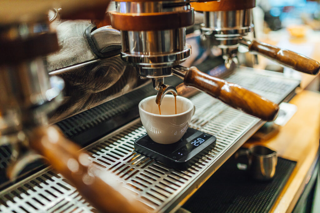 Espresso machine pouring coffee